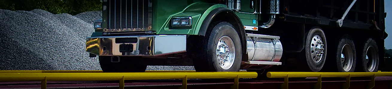 large truck being weighed on a truck scale